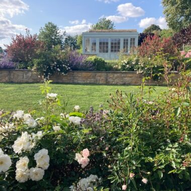 Traditional Cotswolds cottage garden with lavender borders
